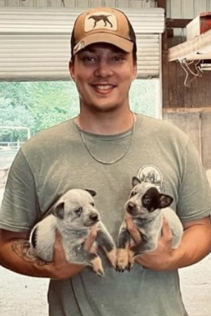 Photo of Wade and two puppies
